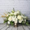 An eye catching, gorgeous all white and gold arrangement in a antiqued