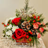 Roses, mini carnations, mums and Christmas Greens fill this sleigh in time