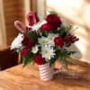 Our Peppermint Christmas Cheer Mug Arrangement is a festive holiday floral design