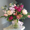 A beautifully selected bunch of the freshest flowers in a vase uniquely