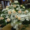 Sympathy mache - includes white spider mums, peach roses, peach carnations, baby&#039;s