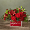 Deck their halls with this lively bouquet studded with surprising red lilies