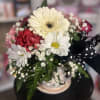 Fresh flowers in polka  dot vase 