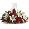 Beautiful holiday evergreens with red and white flowers such as roses, white