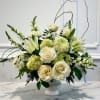 An elevated all-white arrangement designed in a classic pedestal compote. Featuring lush