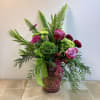 This bouquet has a lively, garden-inspired look with a mix of jewel