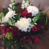 Exquisite white china mums mixed with delicate calla lilies and scrumptiously plump