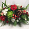 A perfect compliment to any holiday table. Fresh seasonal centerpiece using the