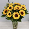 Brighten up anyone's day with this beautiful arrangement of sunflowers. Don't forget