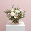 A soft pastel mix of roses, daisies, and alstroemeria arranged in a
