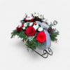 Celebrate the season with this festive Christmas arrangement, nestled in a charming