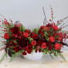 Red is the theme of this arrangement! We mixed together peonies, garden