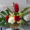 This striking arrangement includes red roses, hydrangea, cymbidium orchids, red ginger, hypericum
