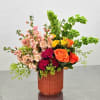Such a happy and cheerful arrangement in tones of Orange, Pinks, Greens
