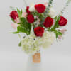 An elegant and timeless arrangement combining premium red roses, white roses, pink