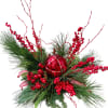 Variety of fresh winter greens, ornament keepsake, permanent berries, branches and ribbon