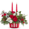 Glow up your holiday table with Teleflora's Evergreen Charm Centerpiece. Red roses