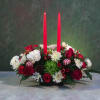 A festive holiday centerpiece with candles. A perfect accent for a holiday