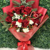 Our beautiful &ldquo;Carol&rdquo; bouquet is a one-sided bouquet with red roses, Christmas
