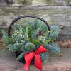 Sweet basket filled with mixed evergreens effervescent of holiday Spirits. 
Deluxe and