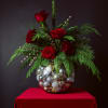 SILVER &amp; SCARLET is a modern holiday arrangement featuring velvety red roses