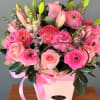 A romantic arrangement featuring pink roses, rananculus, lilies,snapdragons and delicate wax flowers.