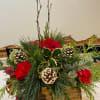 A 16&quot; long wooden &quot;log&quot; is filled with fragrant seasonal greenery, pine
