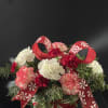 This adorable peppermint container filled with red and white blooms. A perfect