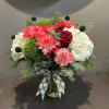 A bright bouquet filled of cheerful Christmas flowers to really brighten your