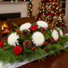 Elevate your holiday table with the Grand Holiday Evergreen Centerpiece. This beautifully