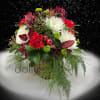 A festive arrangement composed in a bark vase.