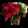 red and white roses , pinecones and pine in leaf lined glass