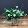 A beautiful arrangement of one dozen white parrot tulips presented in a