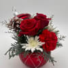 Holiday greens, red flowers in Red Ornament vase 