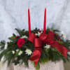 Red and white centerpiece with two tapered candles adorned with a red