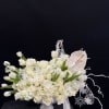 A breathtaking all-white floral masterpiece designed to bring a soft, elegant winter