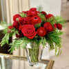 A beautiful, elegant holiday design of roses , pine and ranunculous&hellip; simple