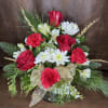 Red Roses and mini gerbera daisies, white alstroemeria, and mums accented with