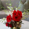 An elegant Christmas arrangement with fresh cut amaryllis &amp; dendrobium orchids.