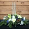 This Beautiful Blue and White oblong Centerpiece with seasonal Greens and Candles