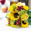 An amazingly sunny bouquet of sunflowers and roses with the addition of