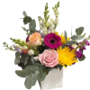 This arrangement combines a harmonious blend of colors and shapes, making it