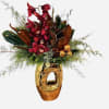 Red cymbidium orchid holiday greens designed in an 11&quot;gold vase with holiday
