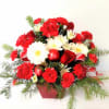 Just the right gift for a happy Christmas wish with carnations,mums,ribbon and