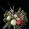 This long lasting arrangement is crafted with a lush grouping of winter
