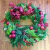 Evoke warm Christmas memories on cold winter nights with this fresh wreath.