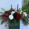 Gorgeous Christmas centerpiece, filled with shades of reds and whites, topped with