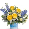 This radiant yellow rose bouquet in an art glass vase feels like