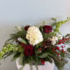 A festive Holiday Centerpiece for your table! This centerpiece will include a