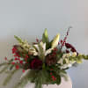 A festive Holiday Centerpiece for your table! This centerpiece will include a